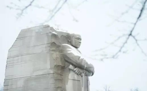 The Martin Luther King Jr. Memorial stands majestic with a light covering of snow in Washington, DC.
