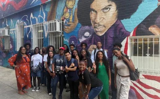 AEF Advance Interns pose in front of the mural at Ben's Chili Bowl
